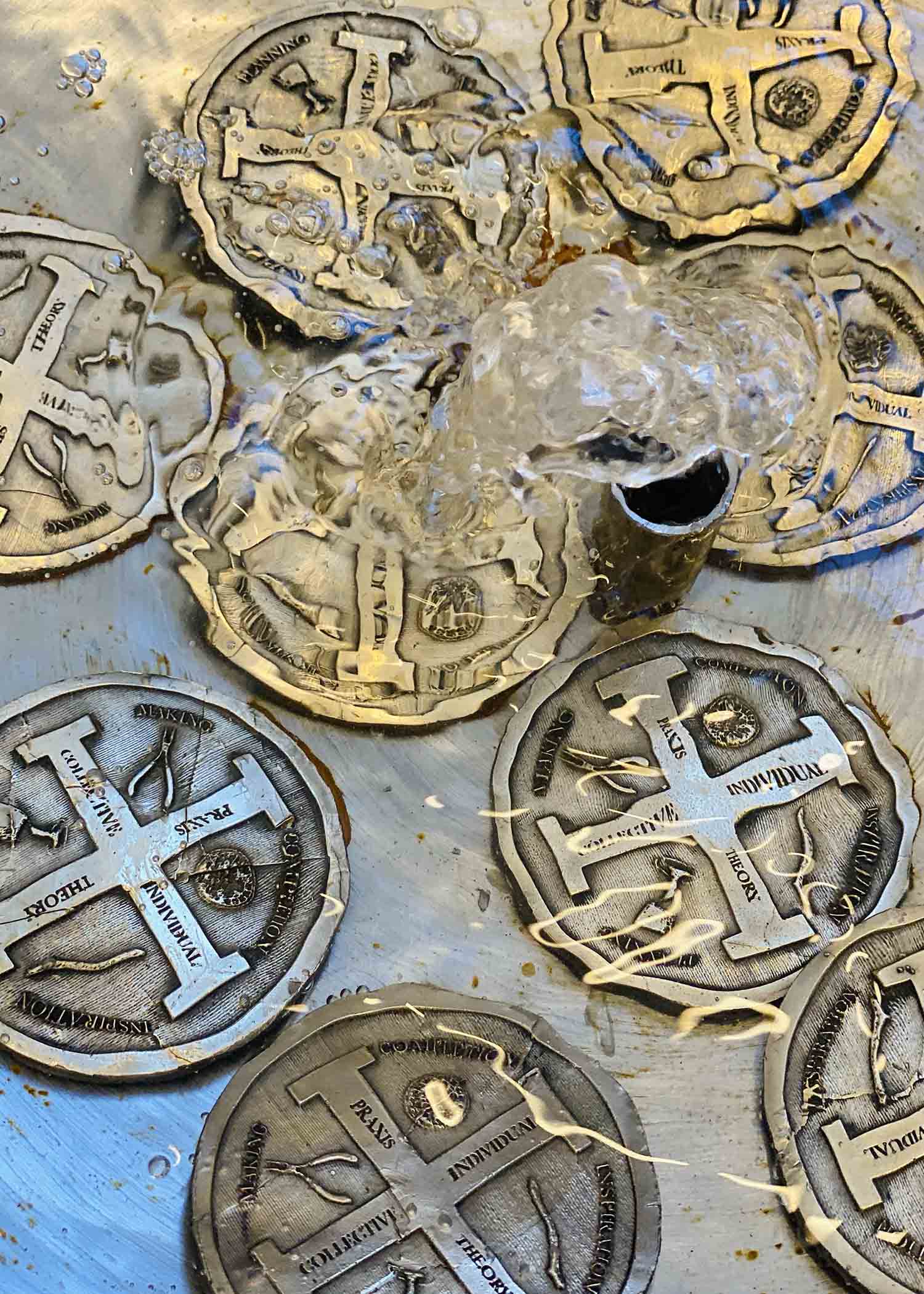 Bronze coins seen through rippling water