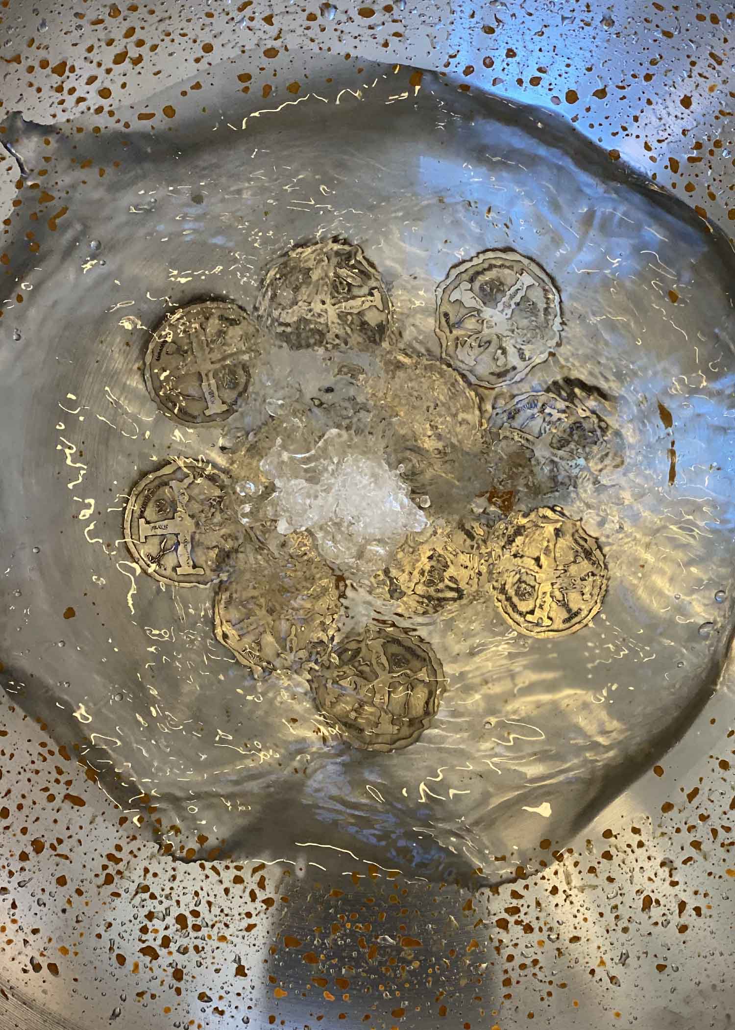 High angle image of the functioning water fountain containing bronze coins