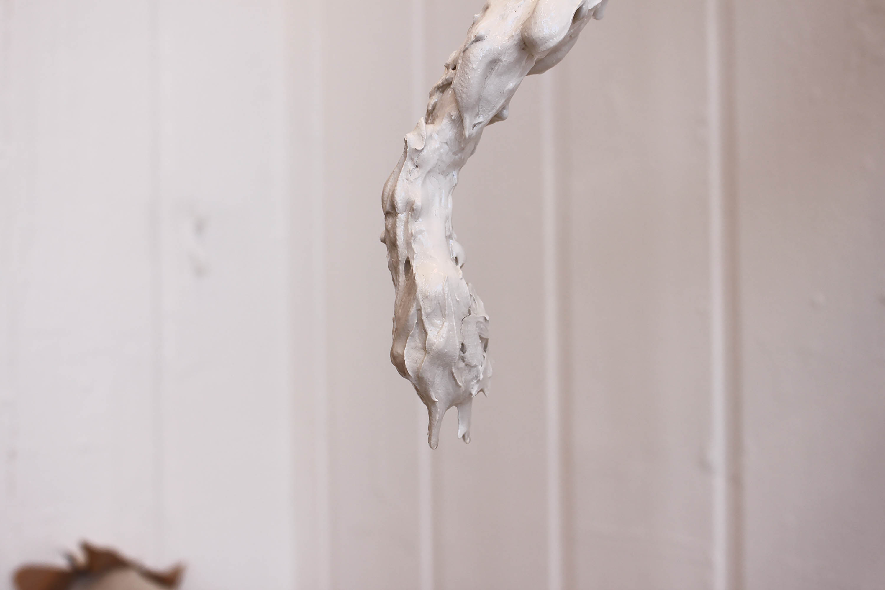 Close-up of a sculpture with dripping Polyfilla.