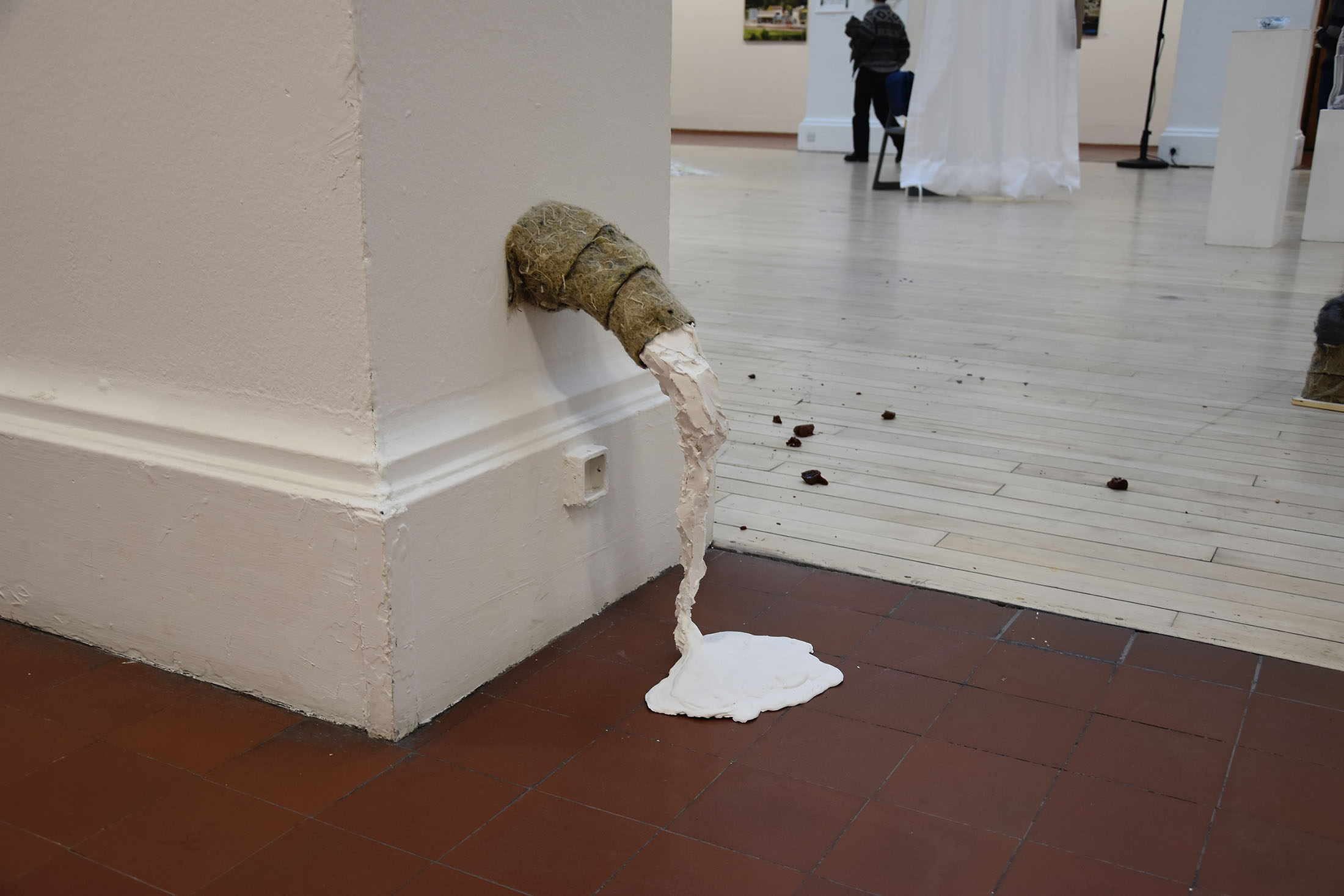 Small sculpture made from Polyfilla and felt insulation, puddling from the wall to the ground