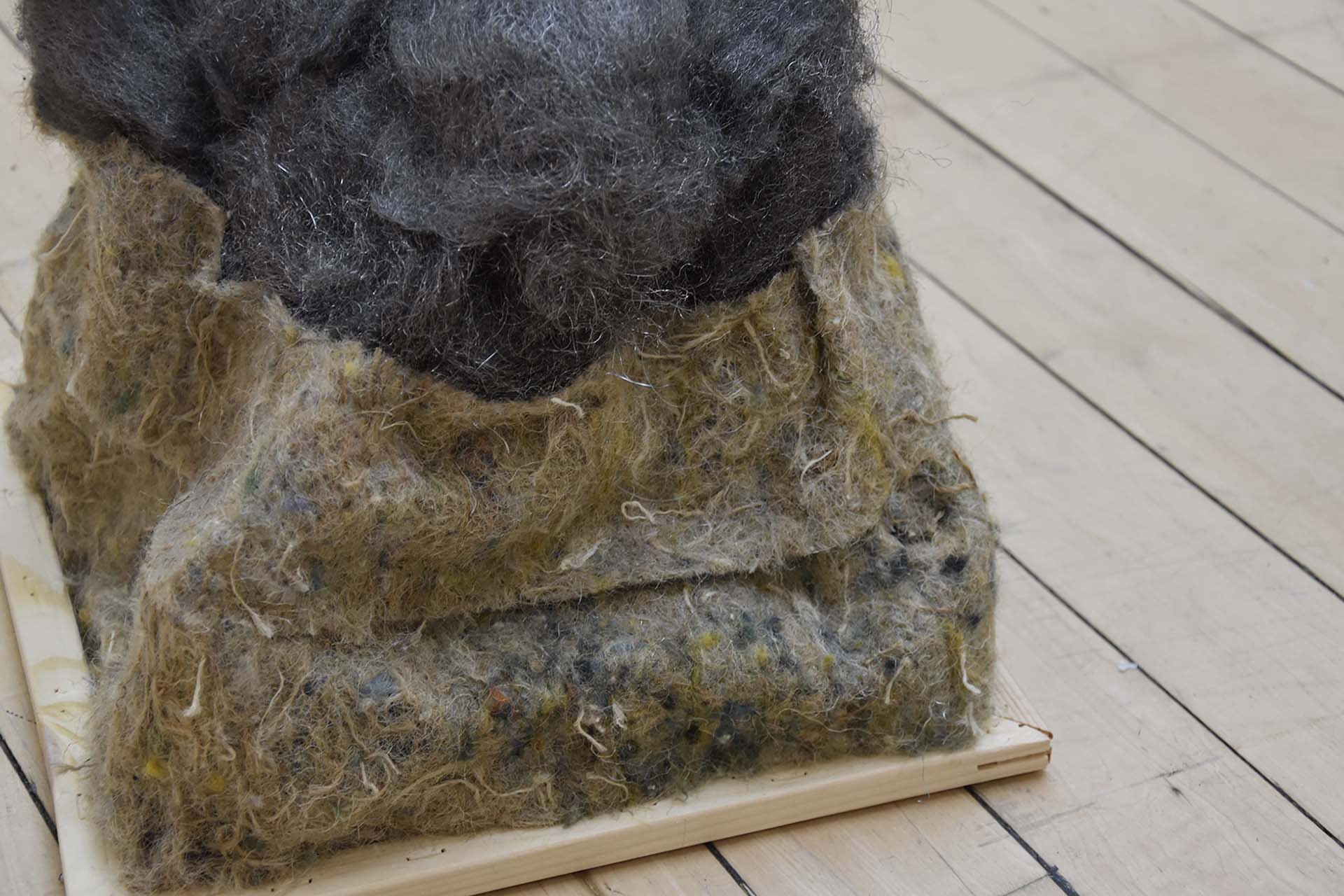 Close-up of a sculpture made from steel wool and felt insulation