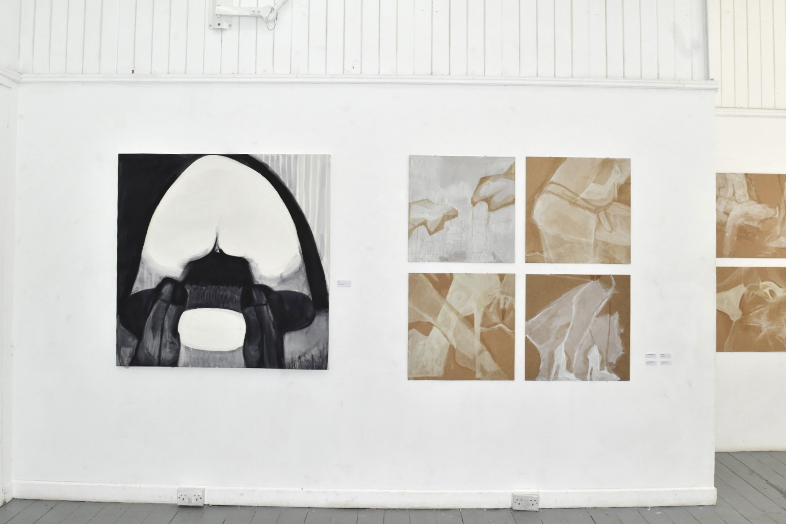 a woman's naked bum with her stockinged feet in the foreground, over a plate