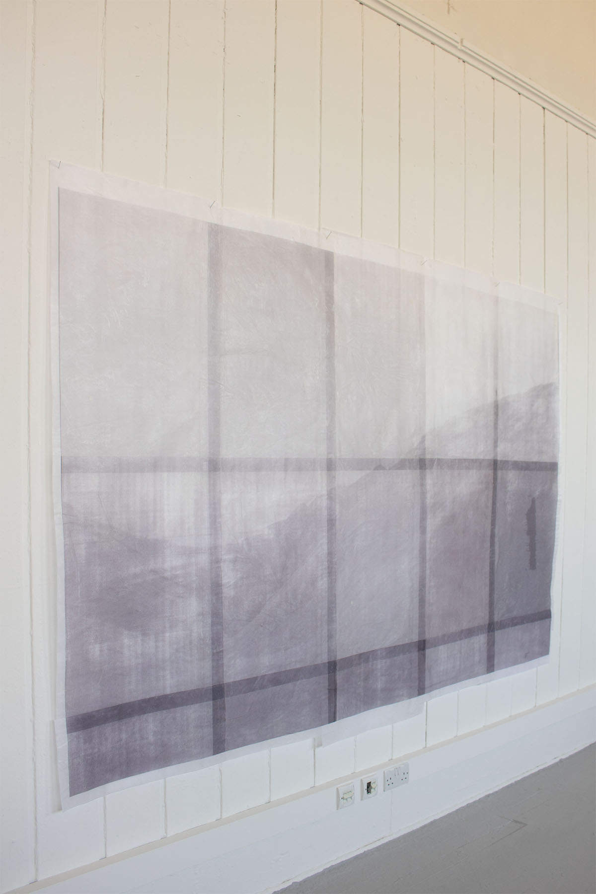 Artwork of a landscape displayed on a wall