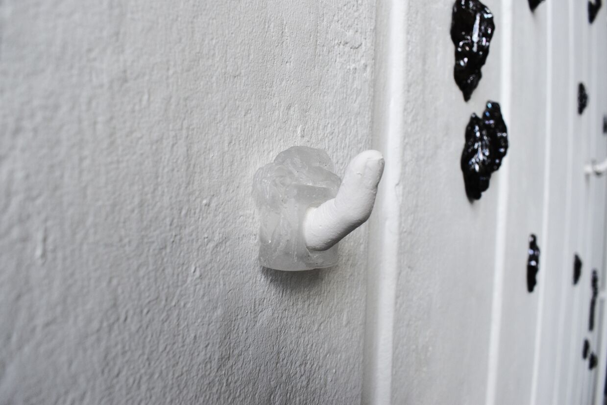 glass ring of a woman laying down. 