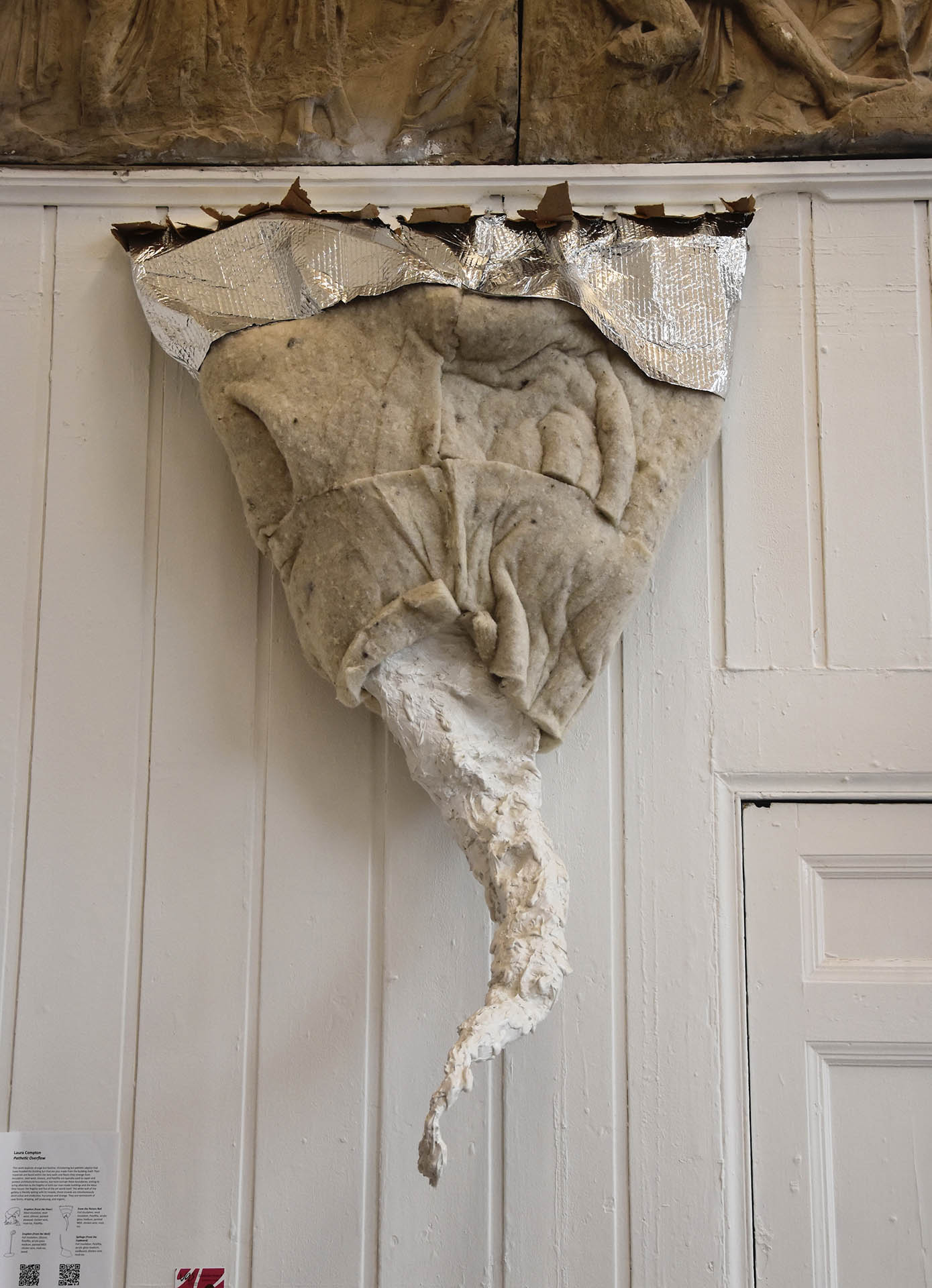 Sculpture made from wool insulation, foil insulation, and Polyfilla bursts from the floor