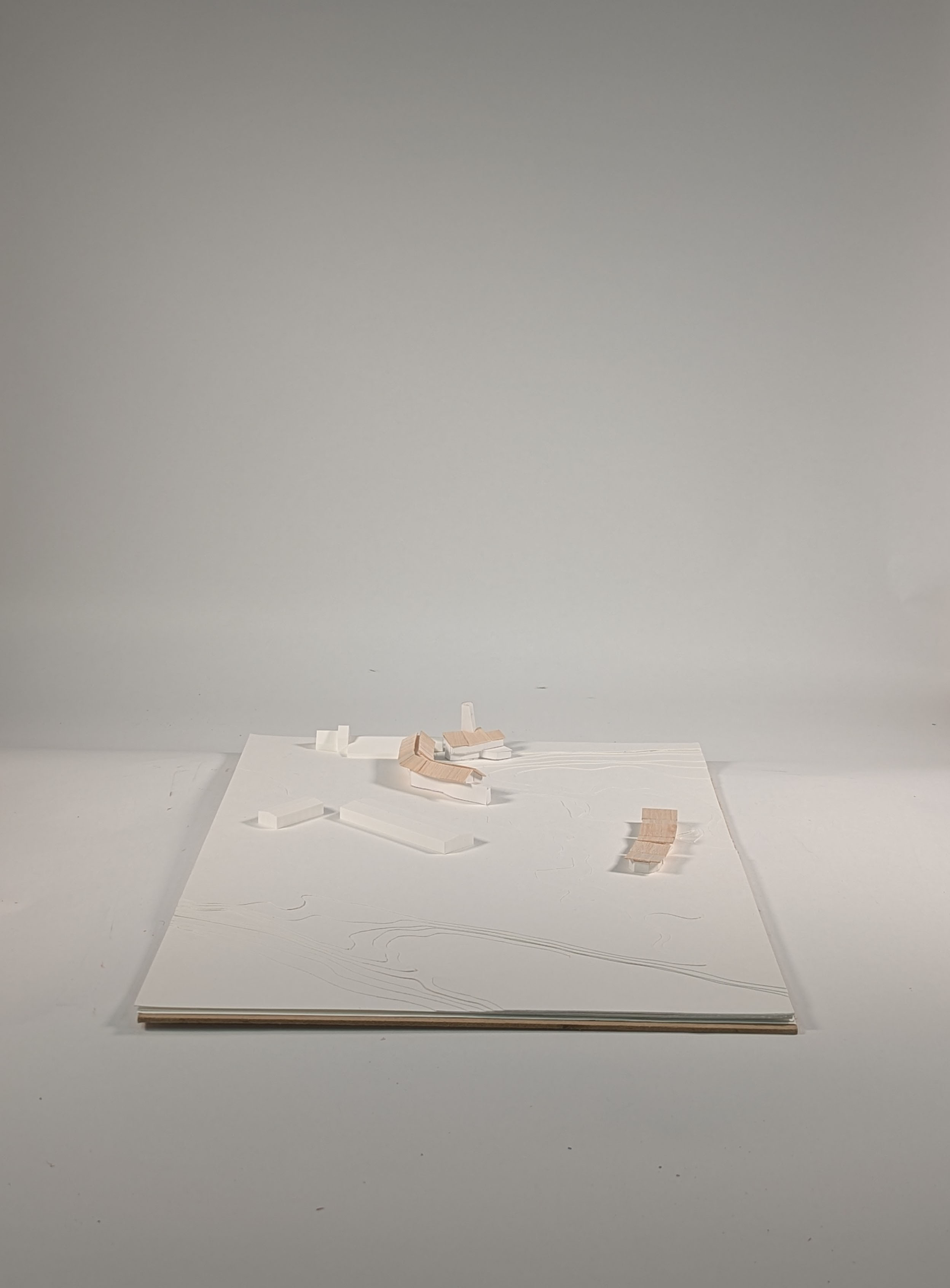 Photo of site model using white card, balsa and 3D printed buildings