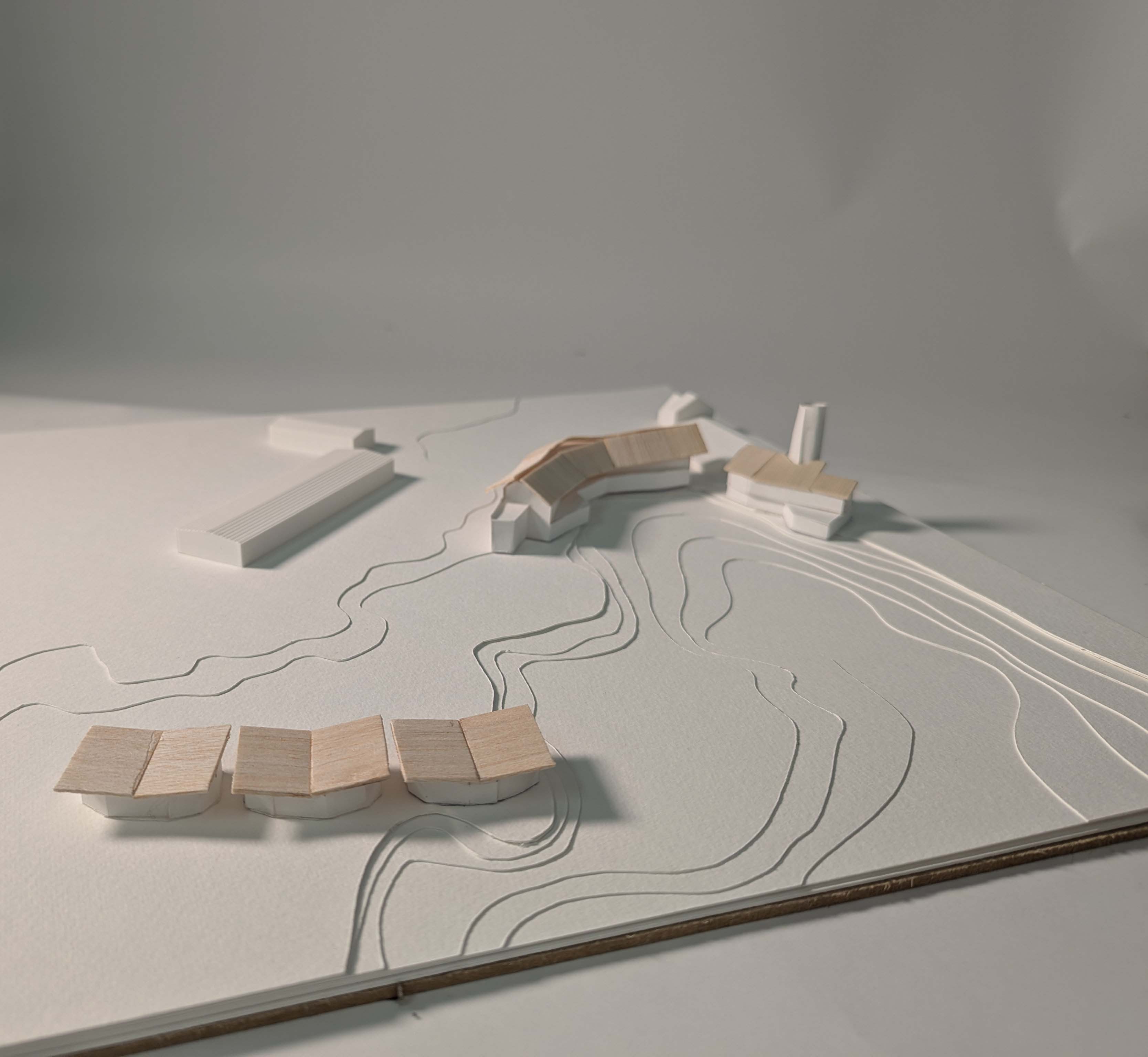 Photo of site model using white card, balsa and 3D printed buildings