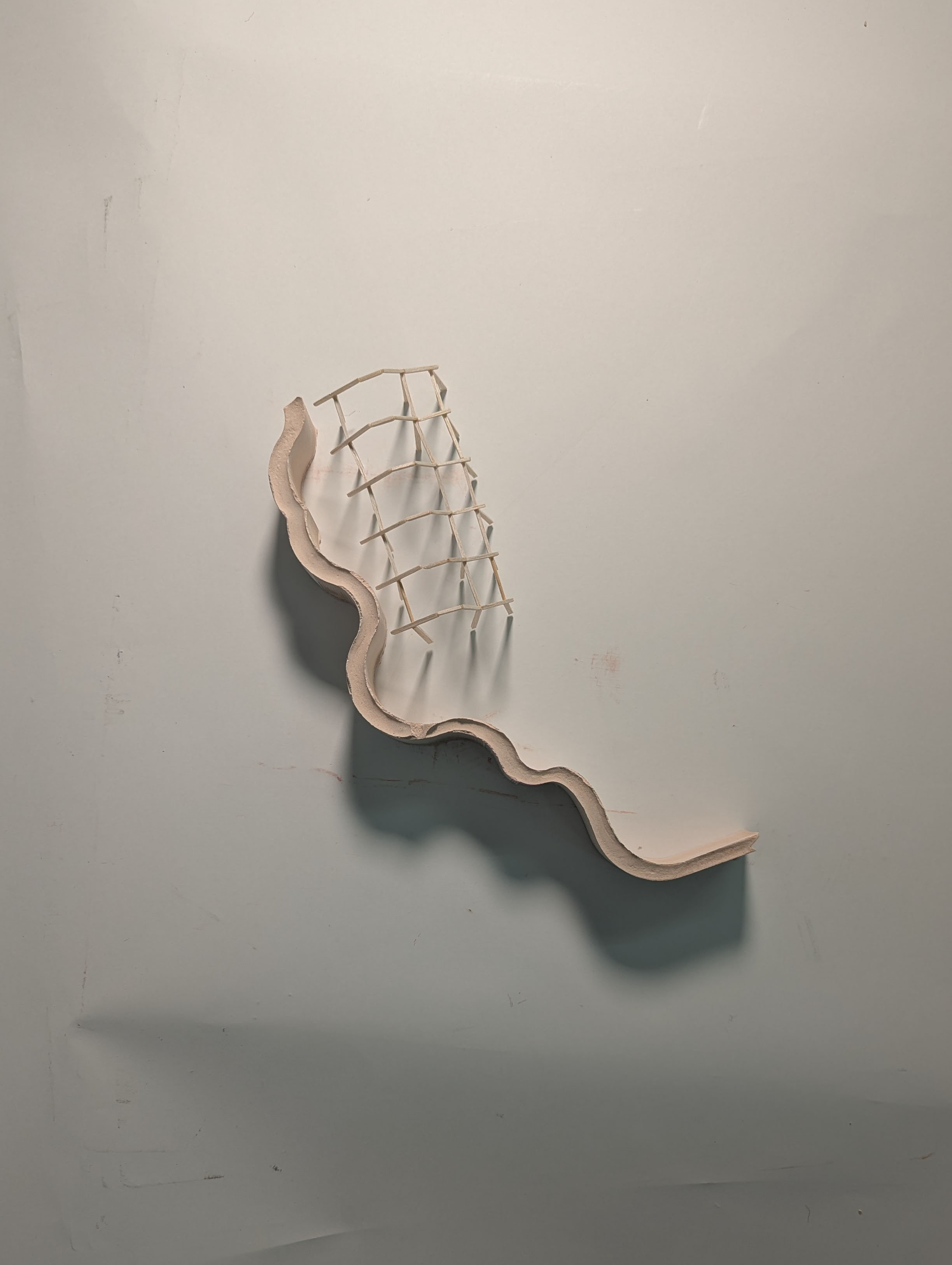Photo of curved wall model using plaster and balsa stick frame