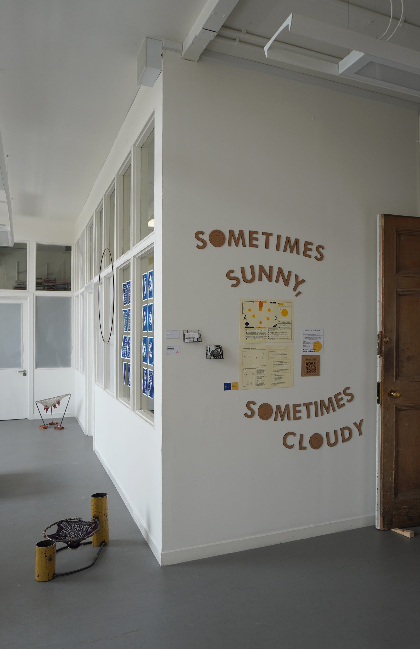  Entrance view of the space with the collaborative title, 'Sometimes Sunny, Sometimes Cloudy'