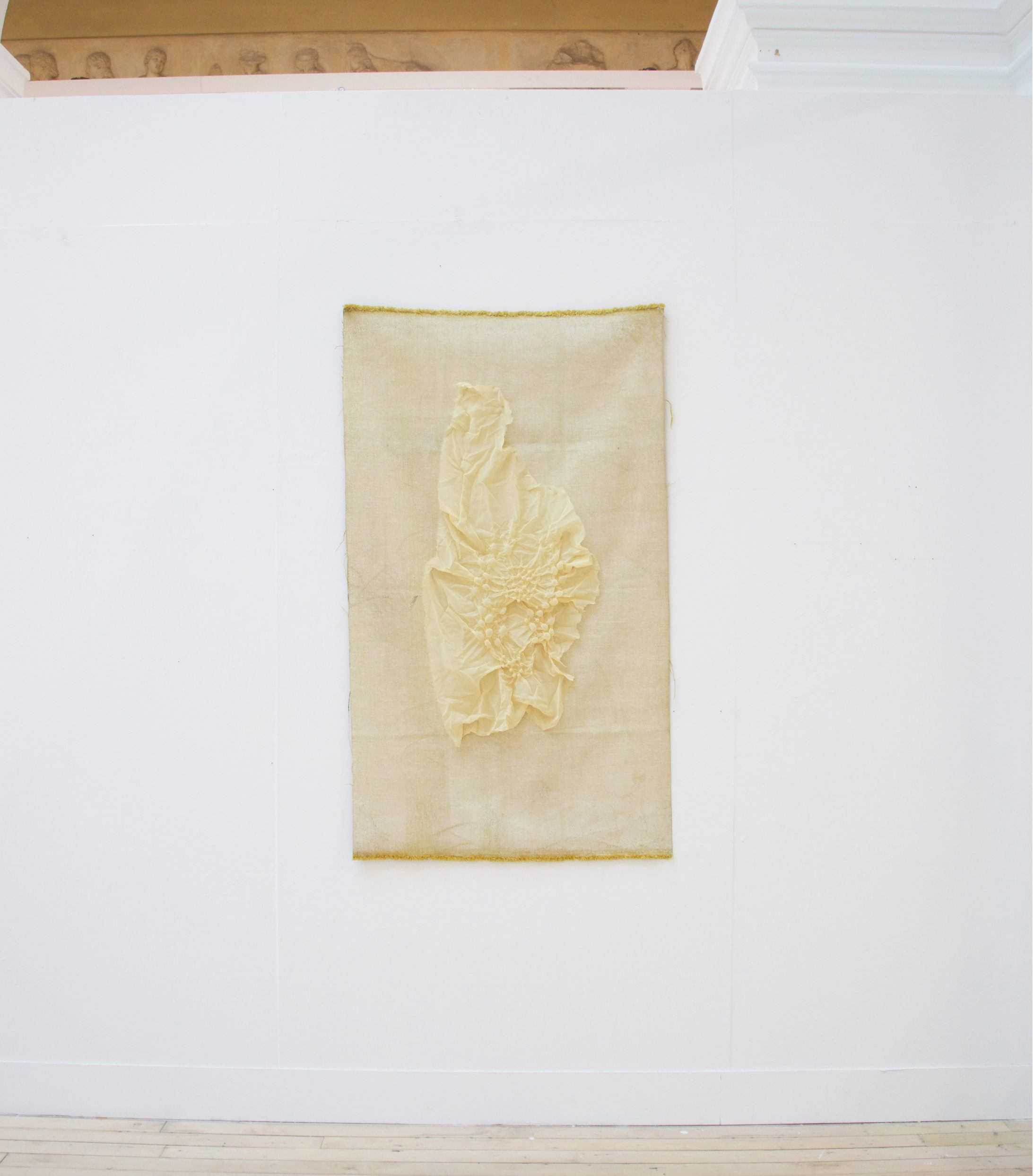 Installed steamed fabric on yellow carpet texture