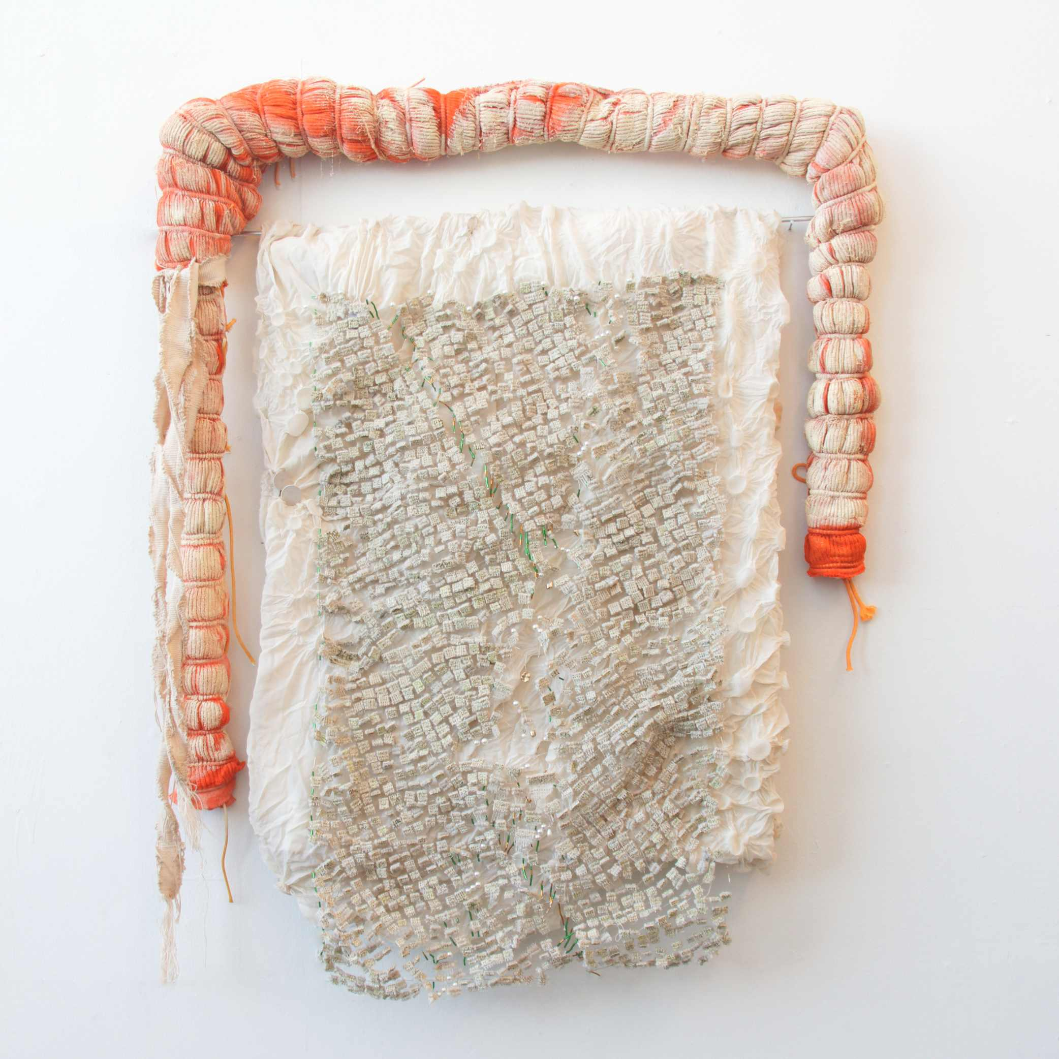 Woven carpet with red fabric framing, mounted onto white steamed fabric 