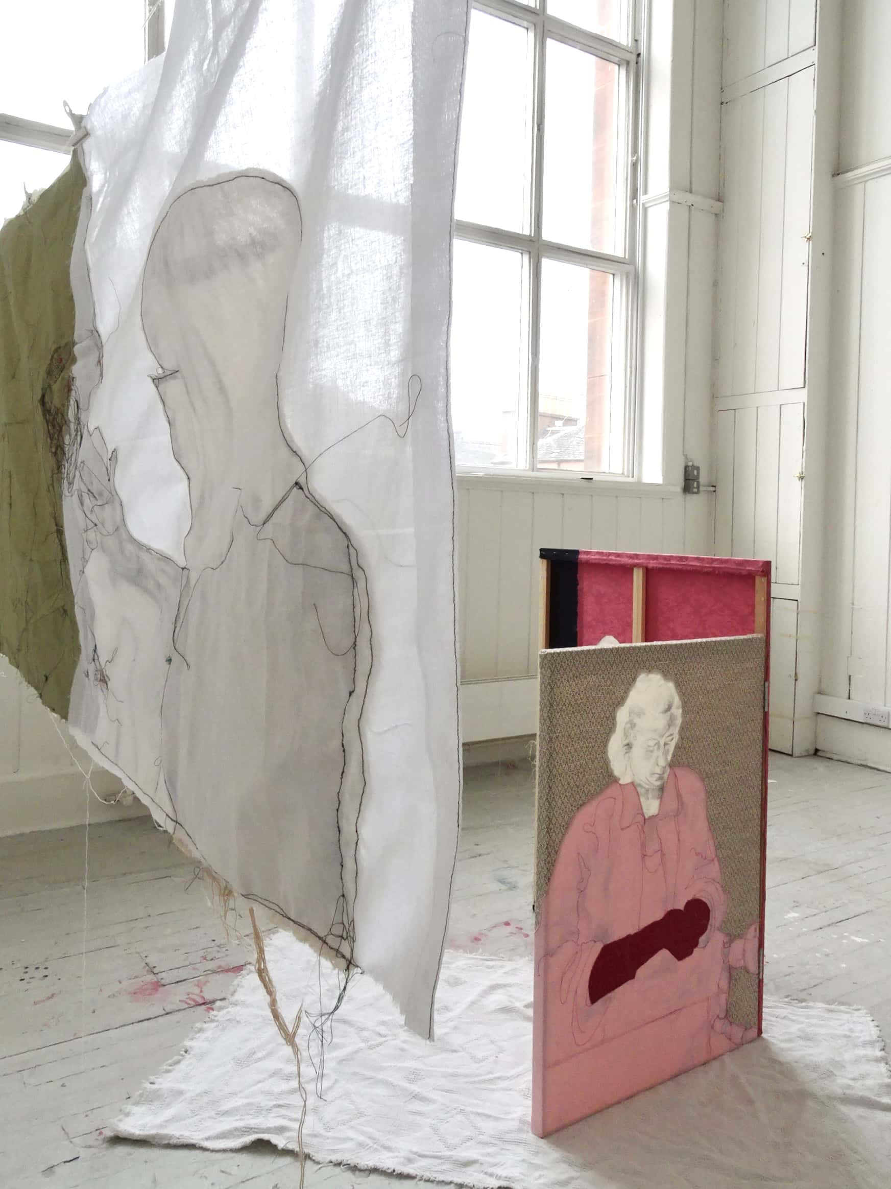 Hung Fabric piece ‘Red Gloves’ in front of Draught Screen ‘Sheila Smith’