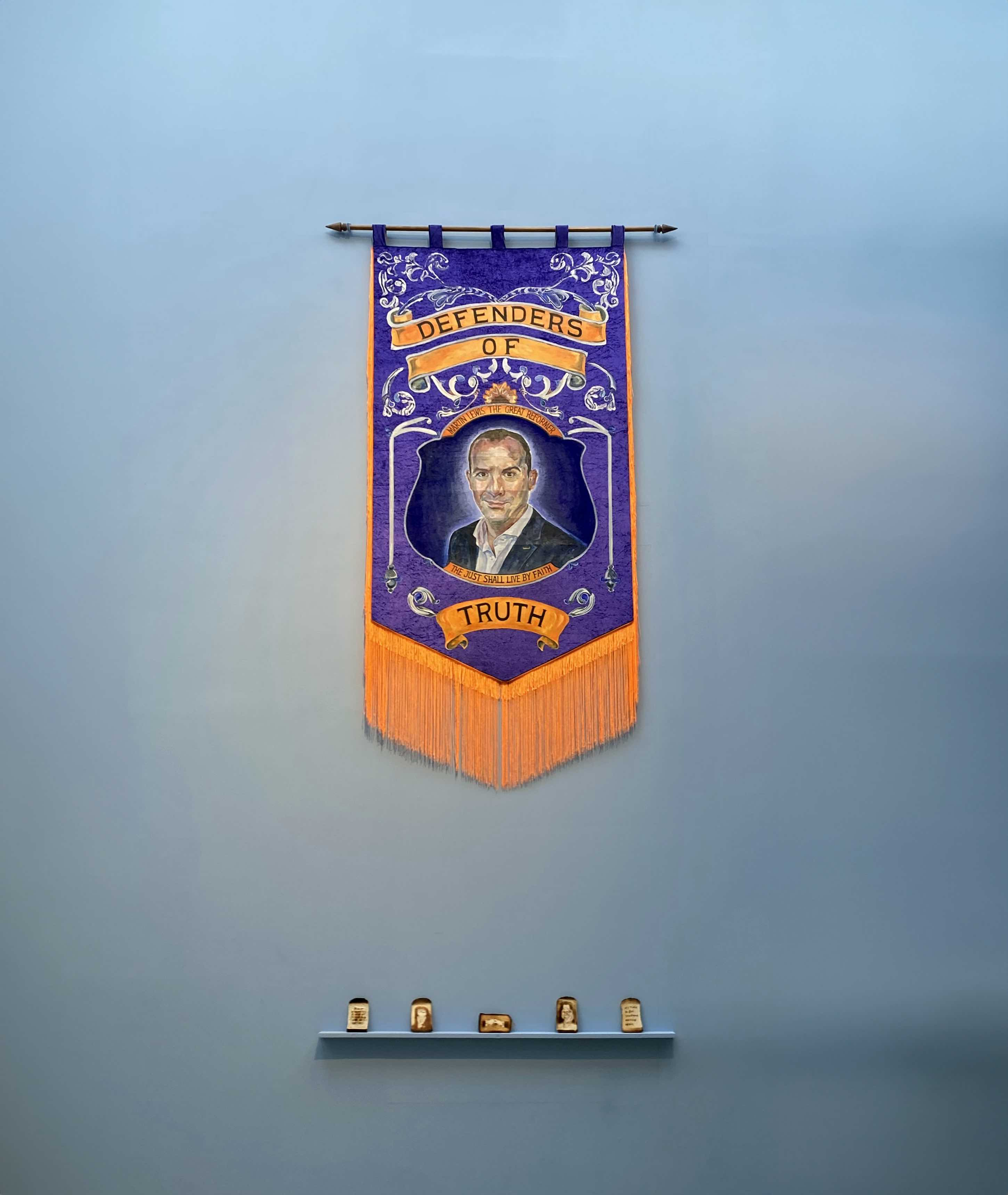 Orange lodge banner featuring Martin Lewis, hung on a blue wall above five slices of toast.