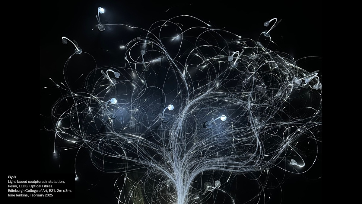 Illuminated sculptures of glass-like snowdrops in the dark connected by a network of roots