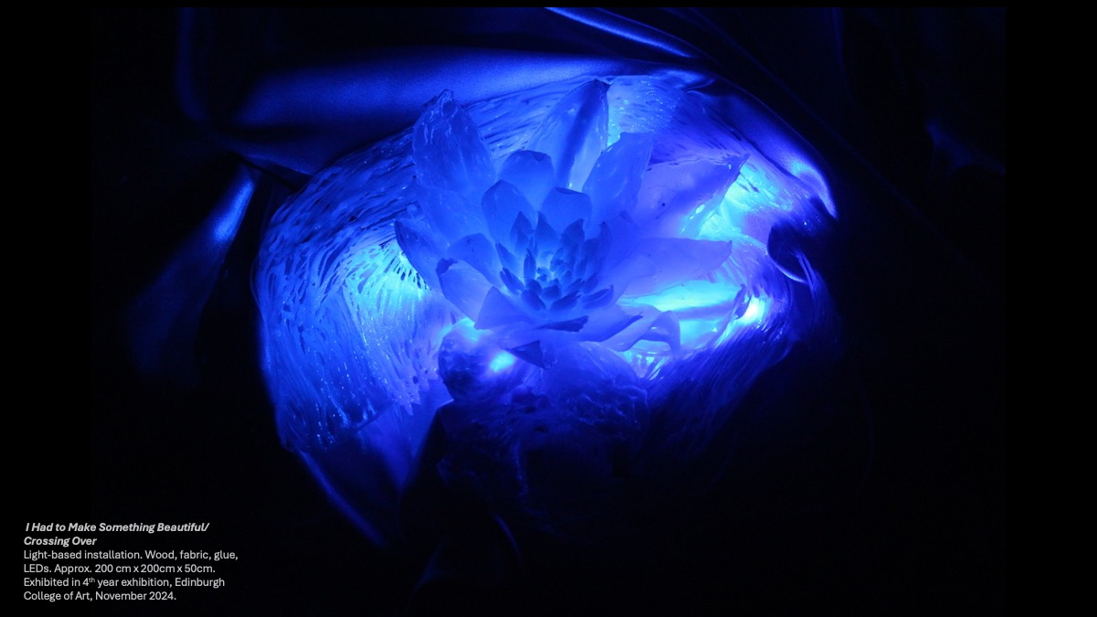 Illuminated sculptures of flowers in fabric like water