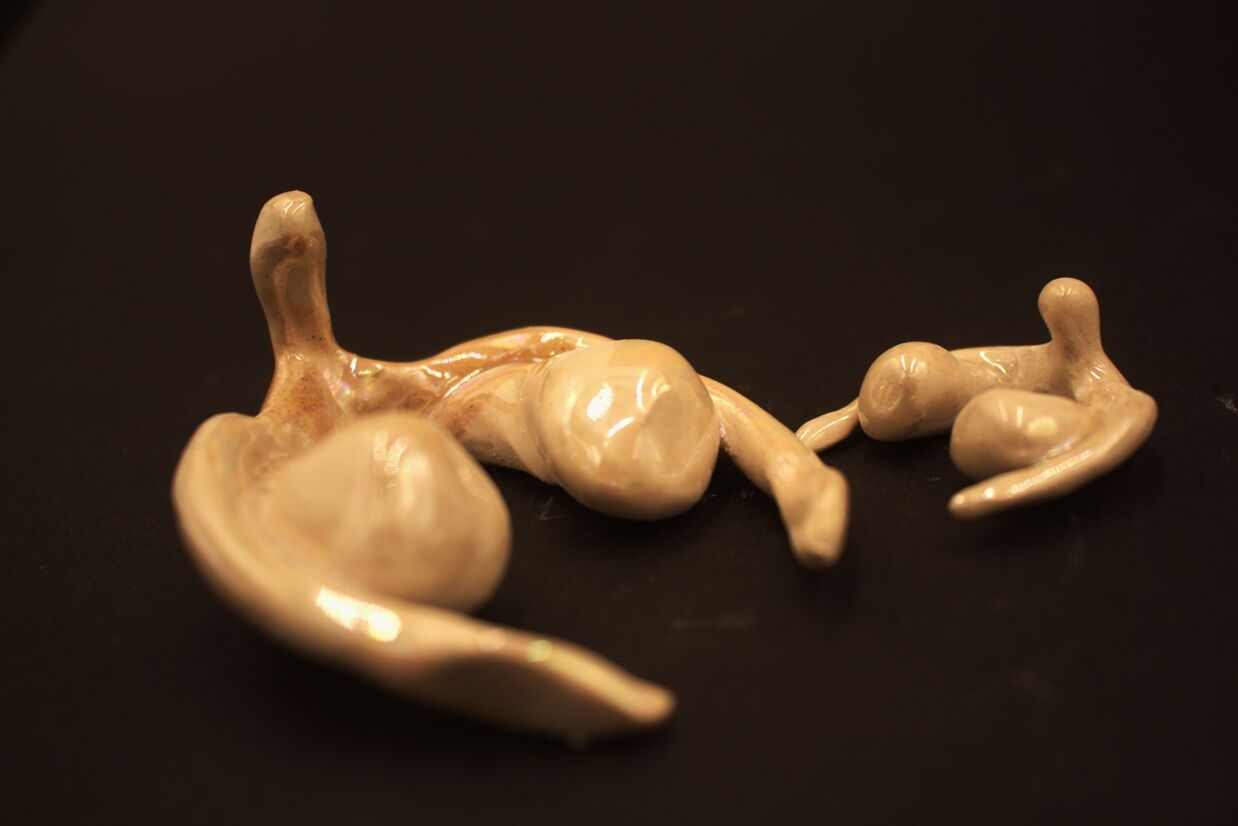 Two clitoris sculptures. One is anatomically sized. 