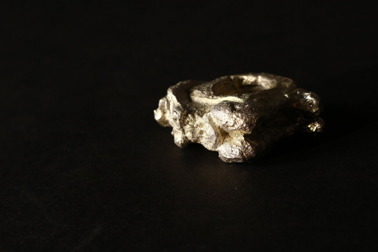 Pewter ring carving of a woman.