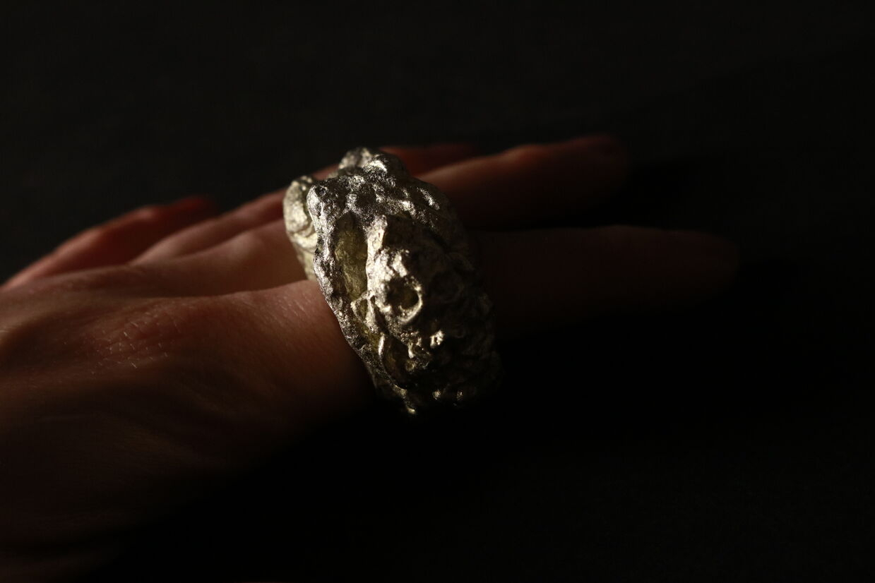 Pewter ring of a woman, worn on a finger.
