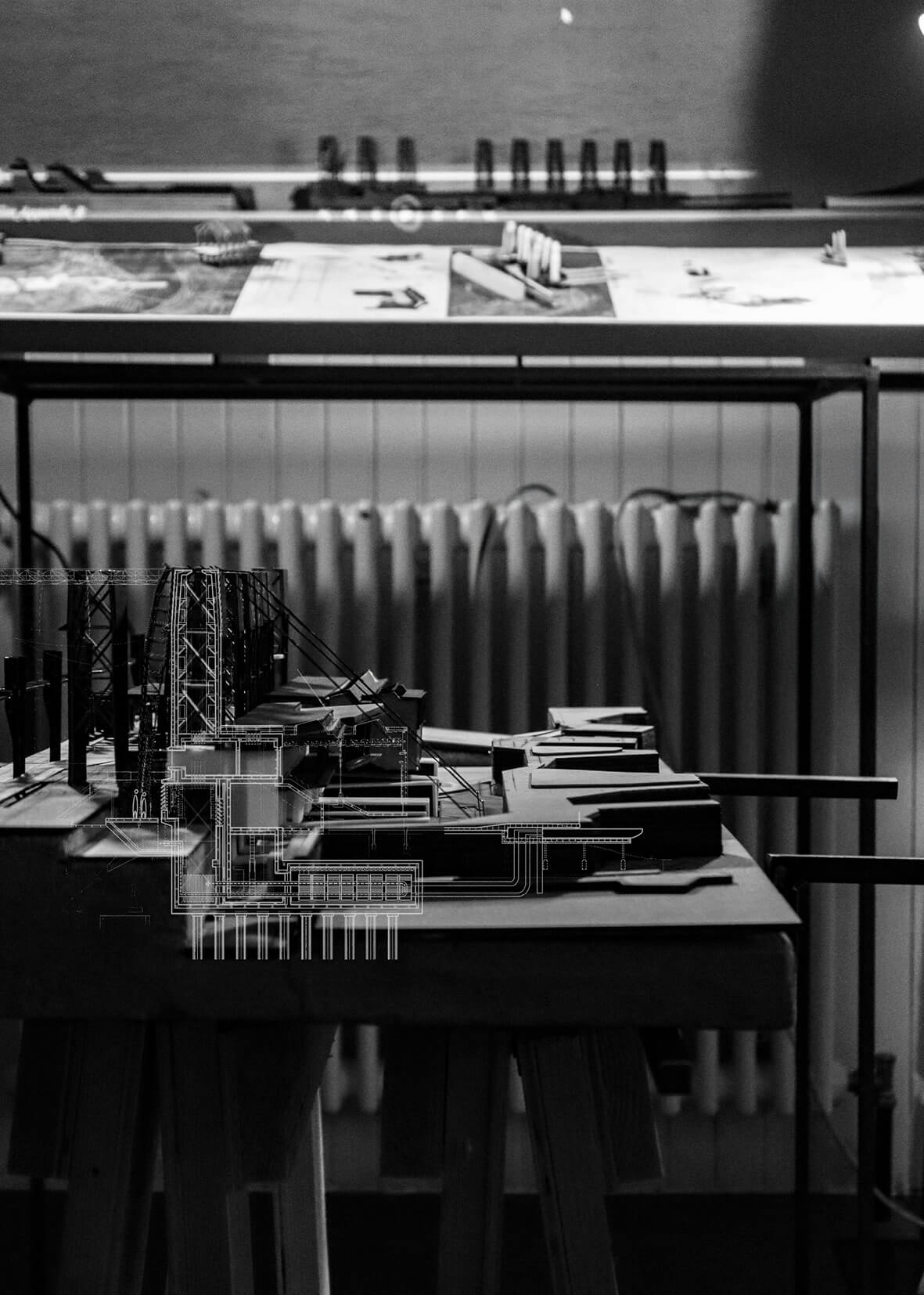 Hybrid image overlaying sectional drawing onto a physical model, revealing the spatial depth and infrastructural logic of the project. This composition explores the intersection of analog craft and digital systems in the design of a reactive civic architecture.