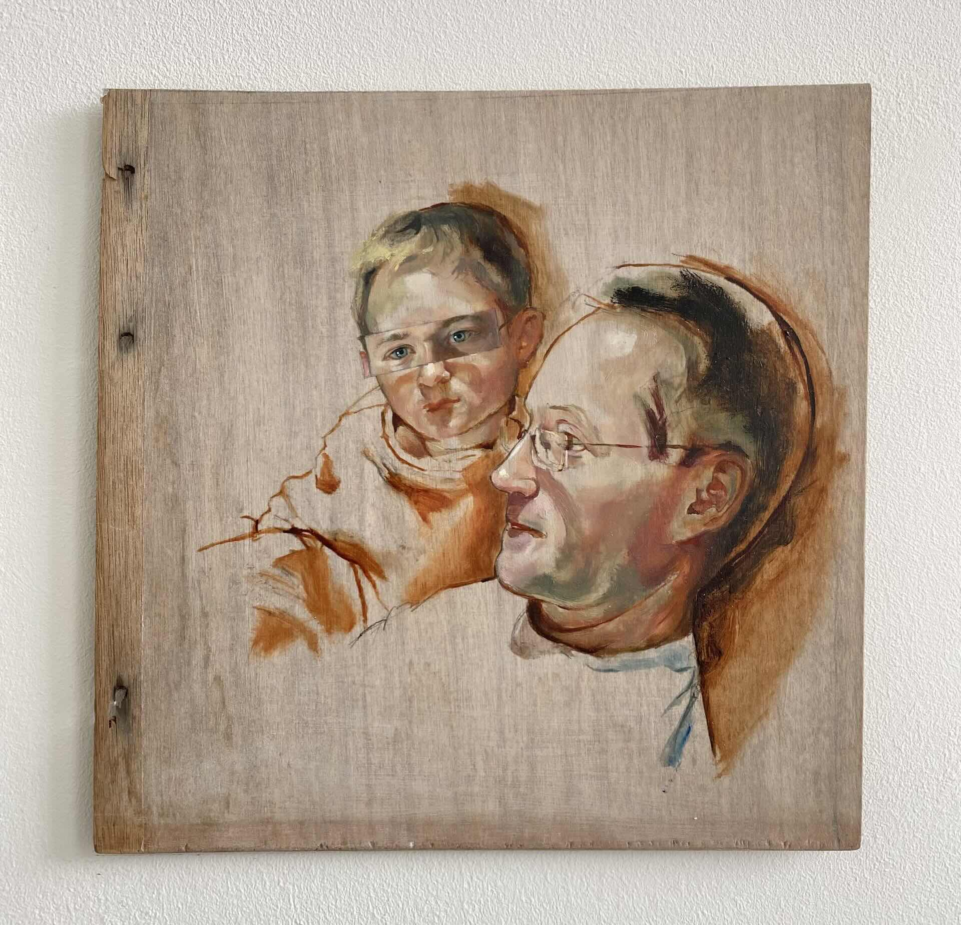 portrait showing the heads a young boy and a man 