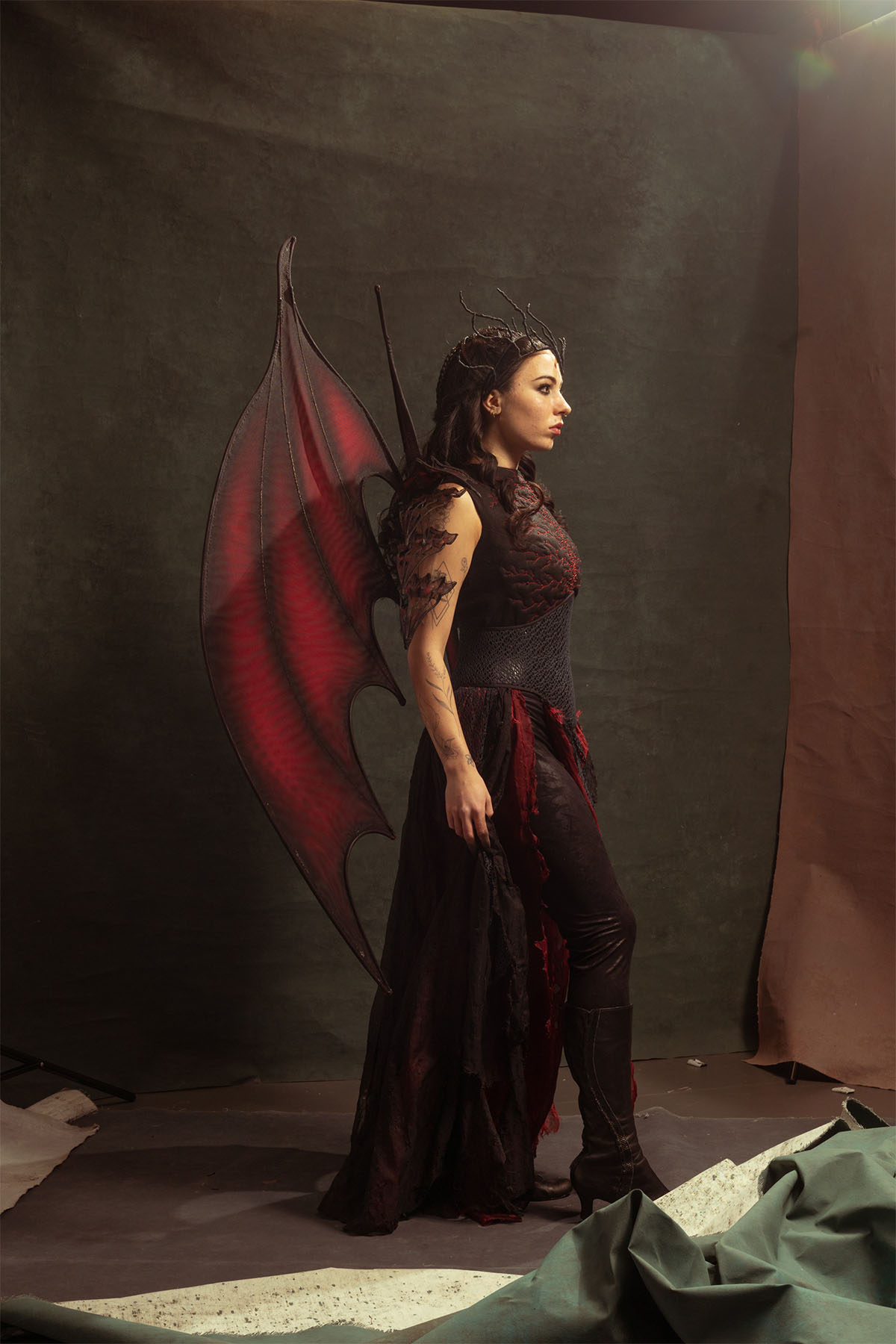 A sideview of the costume for Manon Blackbeak, Queen of witches.