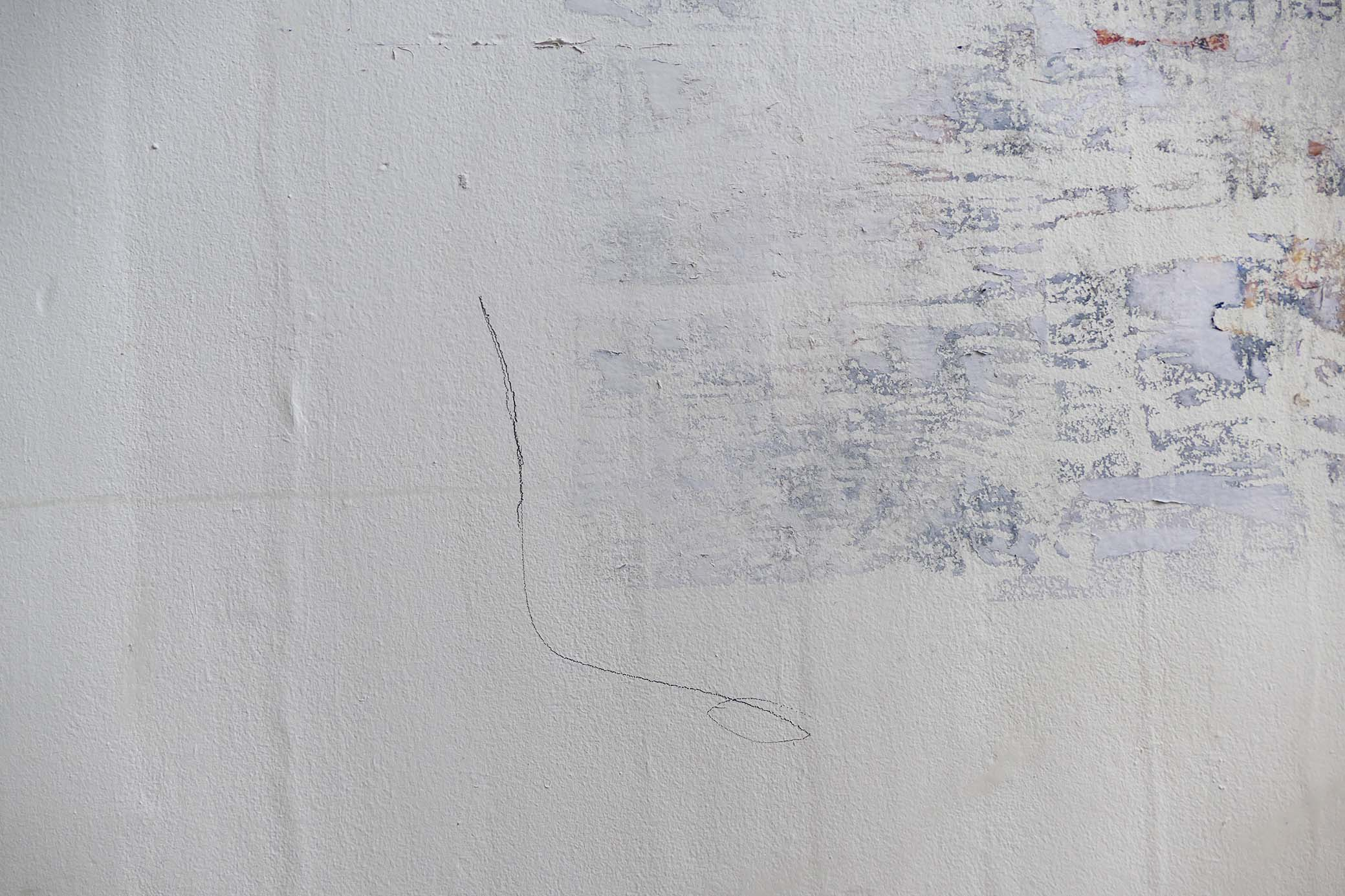 a closeup of a mural with a grainy texture resembling torn down posters - with a single pencil line framing the corner 