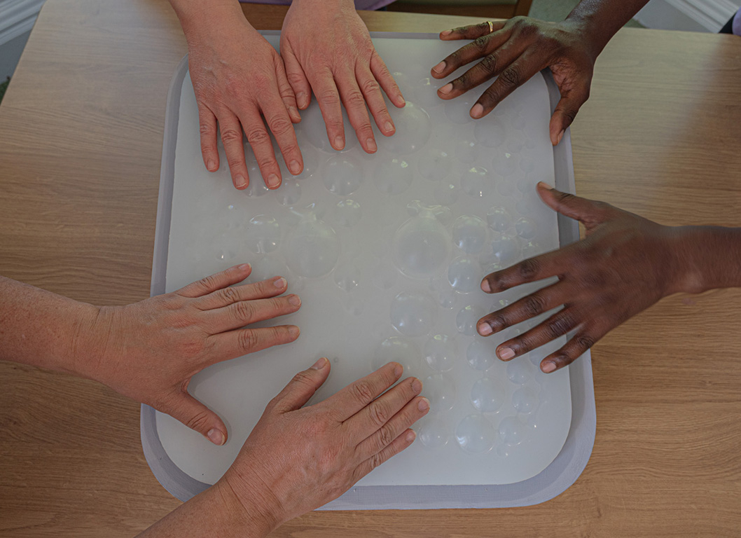 3 carers pairs of hands on flo 