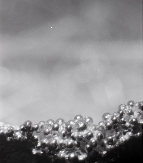 A close up of the granulation texture which consists if small spheres on the surface of the metal.