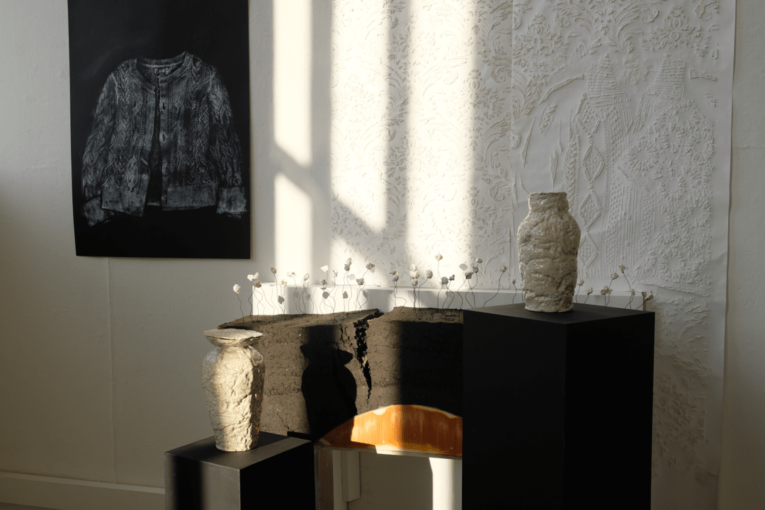 Degree show installation of ceramic pots and earth rammed sculpture.