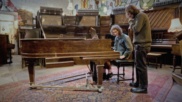 Two people at a grand piano