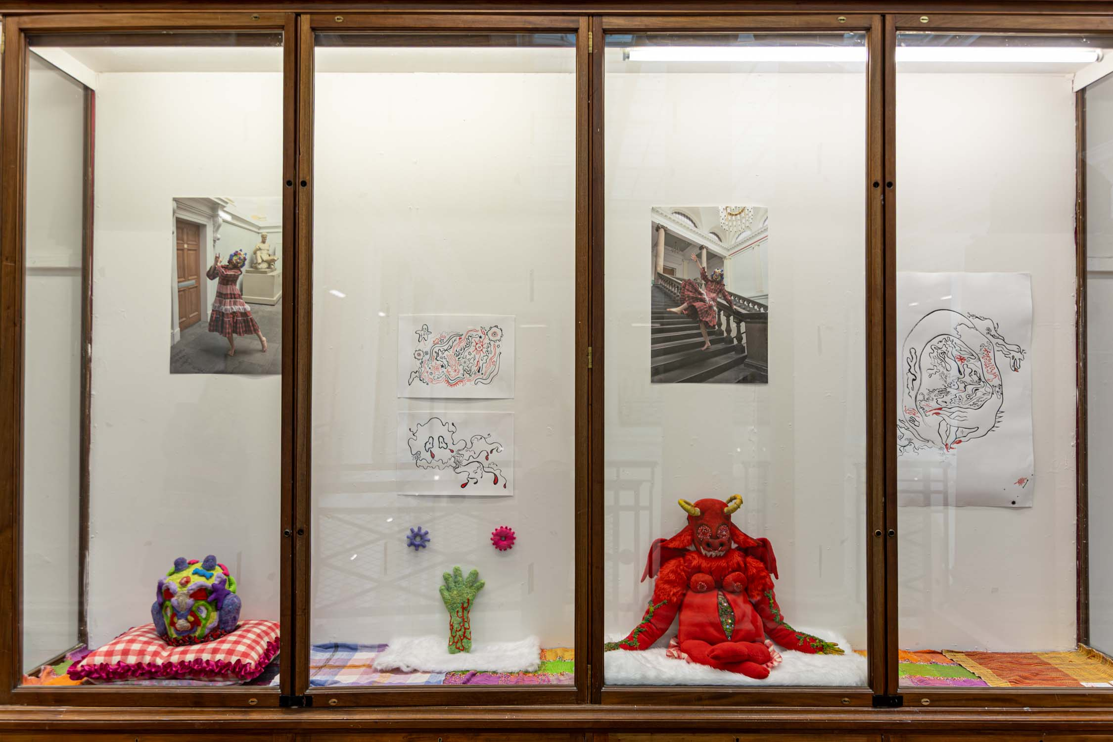 Cabinet with sculptures, drawings and printed images.