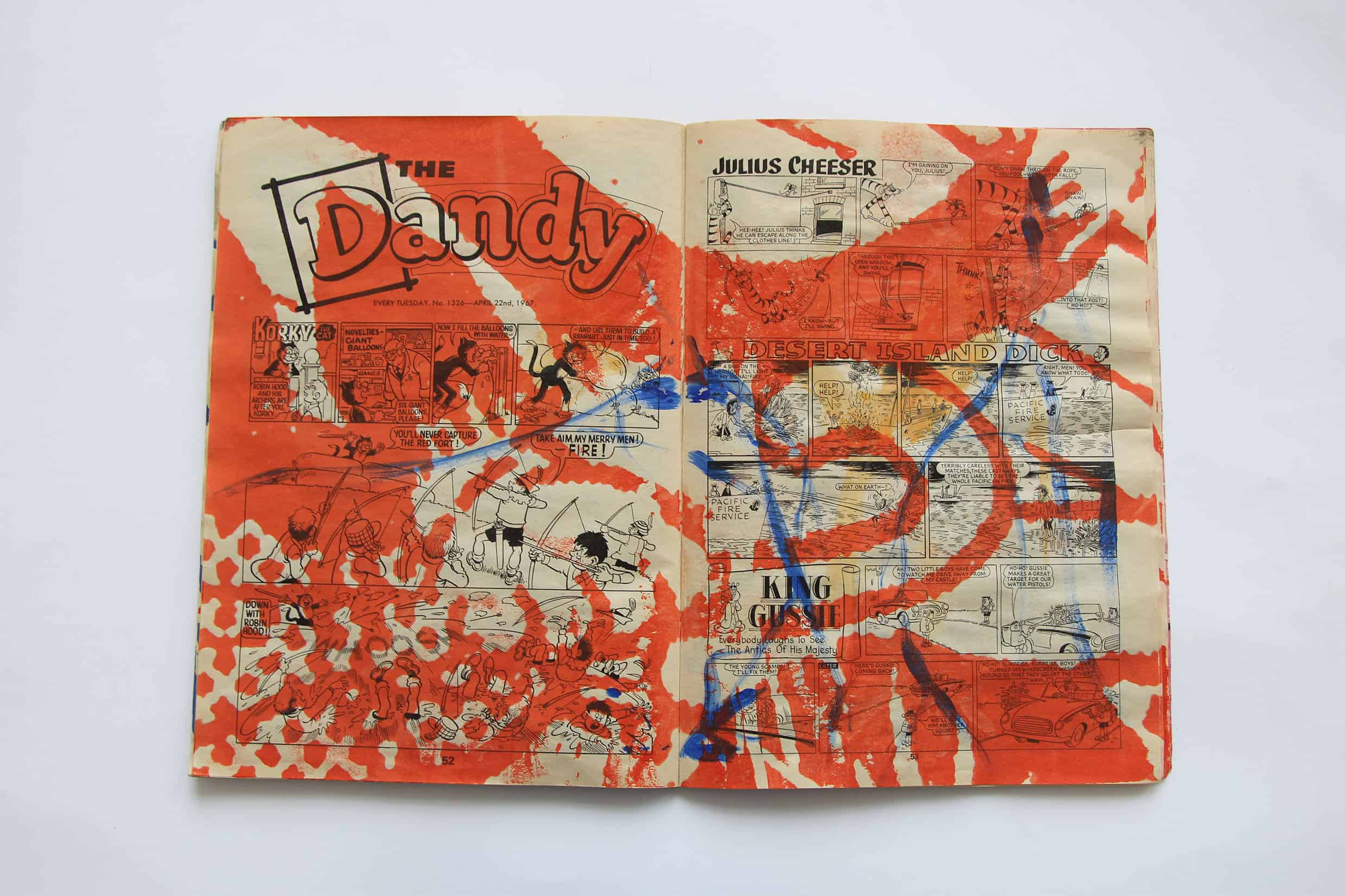 physical comic with screen printed cats tail on top 