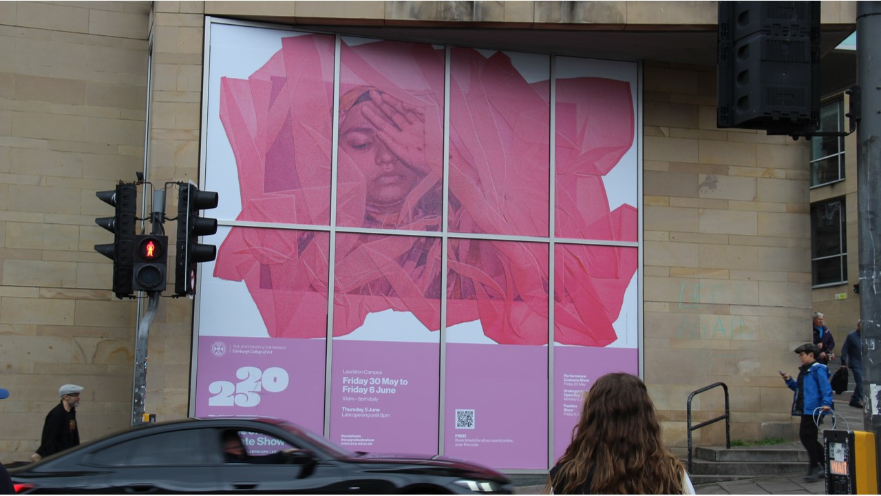 Picture of Poster Campaign outside Evolution House on Lauriston Place, with a car driving past in a blur motion